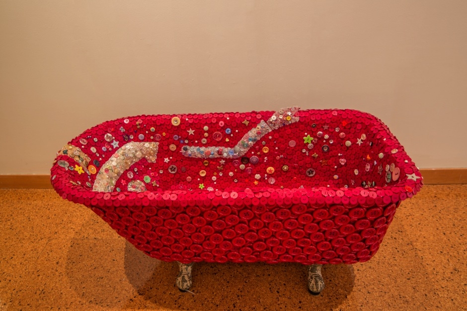 Beau McCall, darkmuskoilegyptiancrystals&floridawater/redpotionno.1, 2014. Buttons, fabric, thread, cast iron tub, 53 x 17 x 23 x 17 inches.