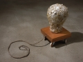 Lisa Kokin, Forget the Story, 2004. Millinery form, buttons, thread, wood, casters, rope, 14 x 8.5 x 40 in.